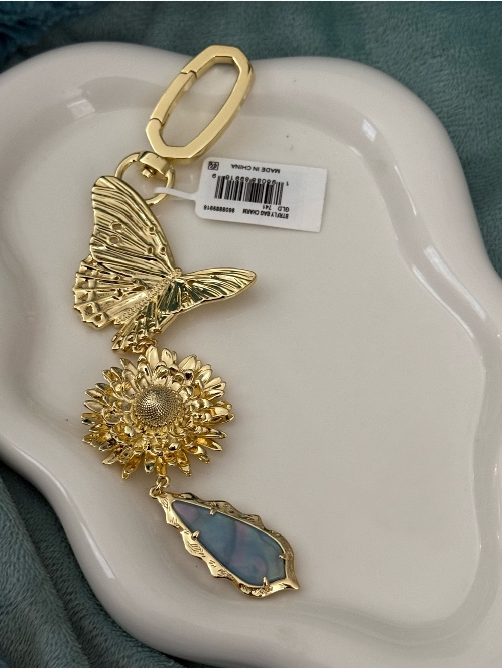 Kendra Scott Gold Butterfly & Floral Charm Keychain with Iridescent Blue Pendant